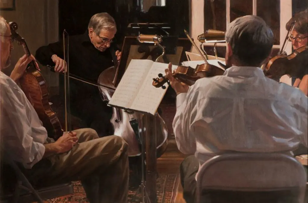 Four musicians sitting in a circle with sheet music playing string instruments