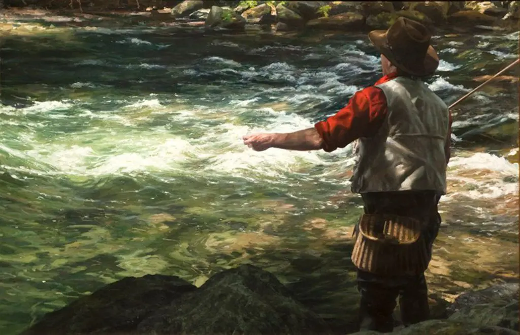 Man wearing a brown hat and red shirt with tan vest, standing in a busy river stripping out his fishing line