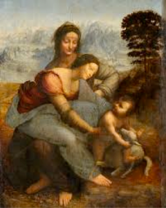 Two women playing with a young baby in an outdoor landscape