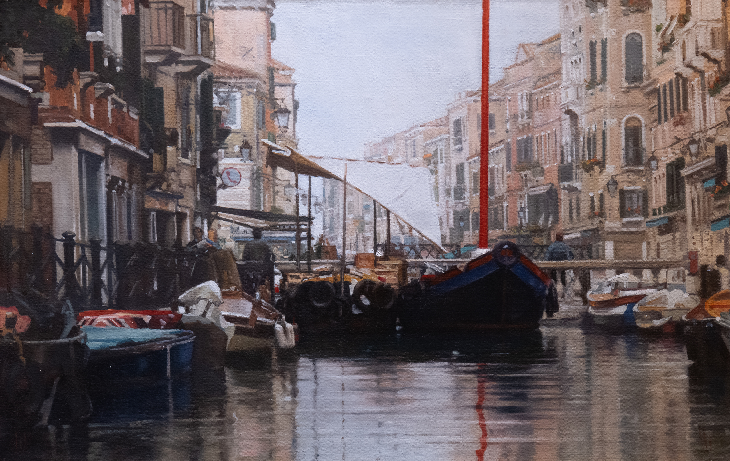 Canal in Venice with boats in the water, surrounded by buildings