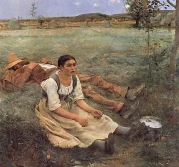 Young woman sitting outside in a field with her lunch while her companion sleeps